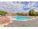 Community pool with lounge chairs and well maintained landscaping at 7440 S Blackhawk St # 12-204, Englewood, CO 80112