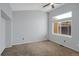 Bedroom with a ceiling fan, neutral paint, and a large window with a view at 162 Blue Spruce Ct, Highlands Ranch, CO 80126