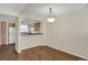 Inviting dining area with a modern chandelier and seamless transition to the kitchen at 162 Blue Spruce Ct, Highlands Ranch, CO 80126