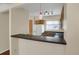 Bright kitchen view features wood cabinets, a white refrigerator, a white stove, and ample counter space at 162 Blue Spruce Ct, Highlands Ranch, CO 80126