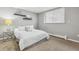 Cozy bedroom with neutral tones, natural light from the window, and modern decor at 1260 N Humboldt St # 1, Denver, CO 80218