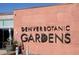 Entrance sign to the Denver Botanic Gardens set on a textured wall and landscaping in view at 1260 N Humboldt St # 1, Denver, CO 80218