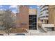 Well-maintained brick apartment building with a modern design and a visible stairwell behind glass at 1260 N Humboldt St # 1, Denver, CO 80218