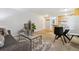 Well-lit living room with a dining area and a view into the kitchen, featuring modern decor at 1260 N Humboldt St # 1, Denver, CO 80218