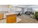 Open-concept living room and kitchen area with hardwood flooring and contemporary furnishings at 1260 N Humboldt St # 1, Denver, CO 80218