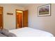 Comfortable bedroom with warm decor and a mountain view displayed in a picture on the wall at 305 S Park Ave # 205, Breckenridge, CO 80424