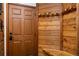 Charming entryway boasts rustic wood accents, a convenient coat rack, and a welcoming ambiance at 305 S Park Ave # 205, Breckenridge, CO 80424