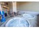 Indoor hot tubs with neutral floors, wood paneling and a lift chair at 305 S Park Ave # 205, Breckenridge, CO 80424