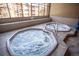 Indoor hot tubs set near a large window with neutral tile and trim at 305 S Park Ave # 205, Breckenridge, CO 80424