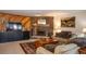 Relaxing living room with comfortable sofas, a stone fireplace, and a stylish TV console for cozy entertainment at 305 S Park Ave # 205, Breckenridge, CO 80424