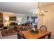 Inviting living room leading into the bedroom, complete with a stone fireplace and comfortable seating arrangements at 305 S Park Ave # 205, Breckenridge, CO 80424