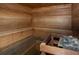 Wooden sauna with built-in benches and a heated rock holder at 305 S Park Ave # 205, Breckenridge, CO 80424