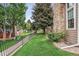 A grassy fenced-in backyard offers a serene retreat at 14121 E Baltic Pl, Aurora, CO 80014
