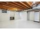 Spacious unfinished basement with white floor, open ceiling and bright light at 14121 E Baltic Pl, Aurora, CO 80014