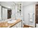 A well-lit bathroom featuring a granite countertop, an oval sink and a separated shower at 14121 E Baltic Pl, Aurora, CO 80014