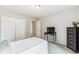 Bedroom with double closets, ceiling fan, and lots of natural light at 14121 E Baltic Pl, Aurora, CO 80014