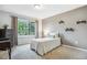 Cozy bedroom with a large window and natural light, perfect for relaxation at 14121 E Baltic Pl, Aurora, CO 80014