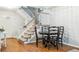 Dining area features hardwood floors and staircase at 14121 E Baltic Pl, Aurora, CO 80014
