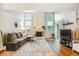 Spacious living room features a fireplace, vaulted ceilings, and wood flooring at 14121 E Baltic Pl, Aurora, CO 80014