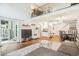 Open concept living area with hardwood floors and slider to patio at 14121 E Baltic Pl, Aurora, CO 80014