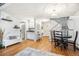 Open concept living room featuring wood floors, a staircase and a chandelier at 14121 E Baltic Pl, Aurora, CO 80014