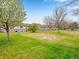 Well maintained backyard featuring a large manicured lawn at 2517 E Egbert St, Brighton, CO 80601