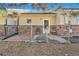 Home backyard featuring a chain link fence and concrete patio at 2517 E Egbert St, Brighton, CO 80601