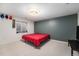 Finished basement bedroom features a window, neutral carpet and an accent wall at 2517 E Egbert St, Brighton, CO 80601