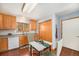 Well-lit kitchen with wooden cabinets and views of backyard at 2517 E Egbert St, Brighton, CO 80601