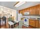 Cozy kitchen featuring bright light, wooden cabinets and granite countertops at 2517 E Egbert St, Brighton, CO 80601