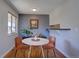 Cozy dining area featuring a round table and sleek chairs adjacent to a bright window at 1105 Bacchus Dr # F8, Lafayette, CO 80026