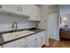 Well-lit kitchen offering bright white cabinetry and dark countertops, great for cooking at 1105 Bacchus Dr # F8, Lafayette, CO 80026