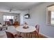 Spacious living room featuring a dining area and a home office, with wood-style flooring throughout at 1105 Bacchus Dr # F8, Lafayette, CO 80026