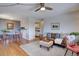 Comfortable living room with a decorative rug, leather couch, and a table and chairs in the background at 1105 Bacchus Dr # F8, Lafayette, CO 80026