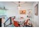 Cozy dining area features a modern light fixture, seating for four, and staircase at 1842 Canyon Blvd # 105, Boulder, CO 80302