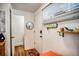 Bright entryway featuring a stylish door, a mirror, and a small shelf for convenience at 1842 Canyon Blvd # 105, Boulder, CO 80302