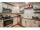 Close-up of renovated kitchen boasting stainless steel appliances and stylish backsplash at 1842 Canyon Blvd # 105, Boulder, CO 80302