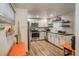 Updated kitchen features stainless steel appliances, white cabinets, and sleek countertops at 1842 Canyon Blvd # 105, Boulder, CO 80302