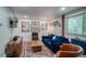 Cozy living room features a comfortable blue sofa, a wooden coffee table, and wall decor at 1842 Canyon Blvd # 105, Boulder, CO 80302