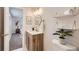 Stylish bathroom with wood vanity, modern fixtures, and tasteful decor at 12932 E Elgin Pl, Denver, CO 80239