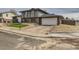 Two-story home with an attached garage, green lawn detail and minimalist rock landscape at 12932 E Elgin Pl, Denver, CO 80239