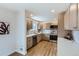 Stylish kitchen with stainless steel appliances and ample counter space at 12932 E Elgin Pl, Denver, CO 80239