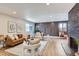 Bright and spacious living room featuring luxury furnishings and modern decor at 12932 E Elgin Pl, Denver, CO 80239