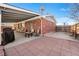 Spacious backyard featuring a brick patio, basketball hoop, and access to the covered patio at 3395 W Union Ave, Englewood, CO 80110