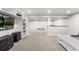 Expansive basement with neutral carpet, a column support, a TV, and lots of space for flexible layouts at 3395 W Union Ave, Englewood, CO 80110