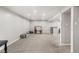 Open basement area offers flexible living with neutral carpeting, recessed lighting, and plenty of space for customization at 3395 W Union Ave, Englewood, CO 80110