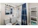 Well-lit bathroom with a vanity, shower, and toilet, designed for comfort and efficiency at 3395 W Union Ave, Englewood, CO 80110