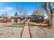 Charming brick home with a well-maintained front yard and inviting entrance at 3395 W Union Ave, Englewood, CO 80110
