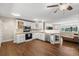Bright and airy kitchen with white cabinetry, stainless steel appliances, and hardwood floors at 3395 W Union Ave, Englewood, CO 80110