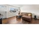 Sunlit living room with hardwood floors and comfortable seating, creating a welcoming space at 3395 W Union Ave, Englewood, CO 80110